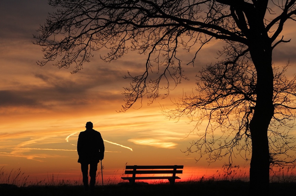 old man watching the sunset